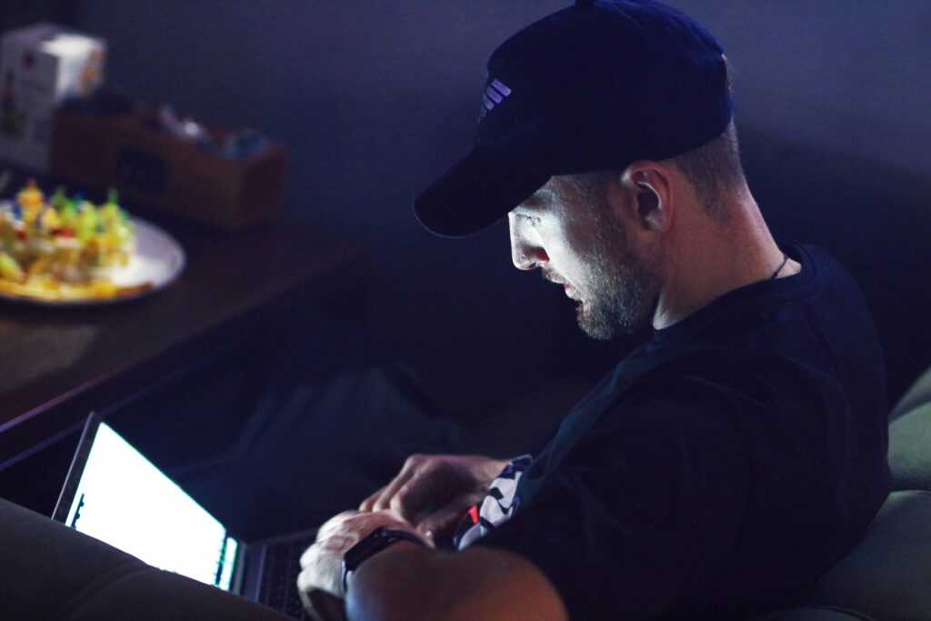 Person using a laptop in low light