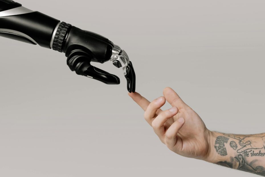 Human finger reaching toward a robotic hand