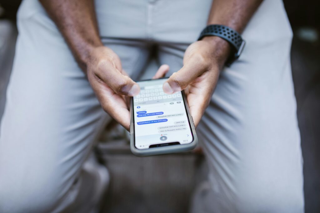 Person viewing a conversation on a smartphone