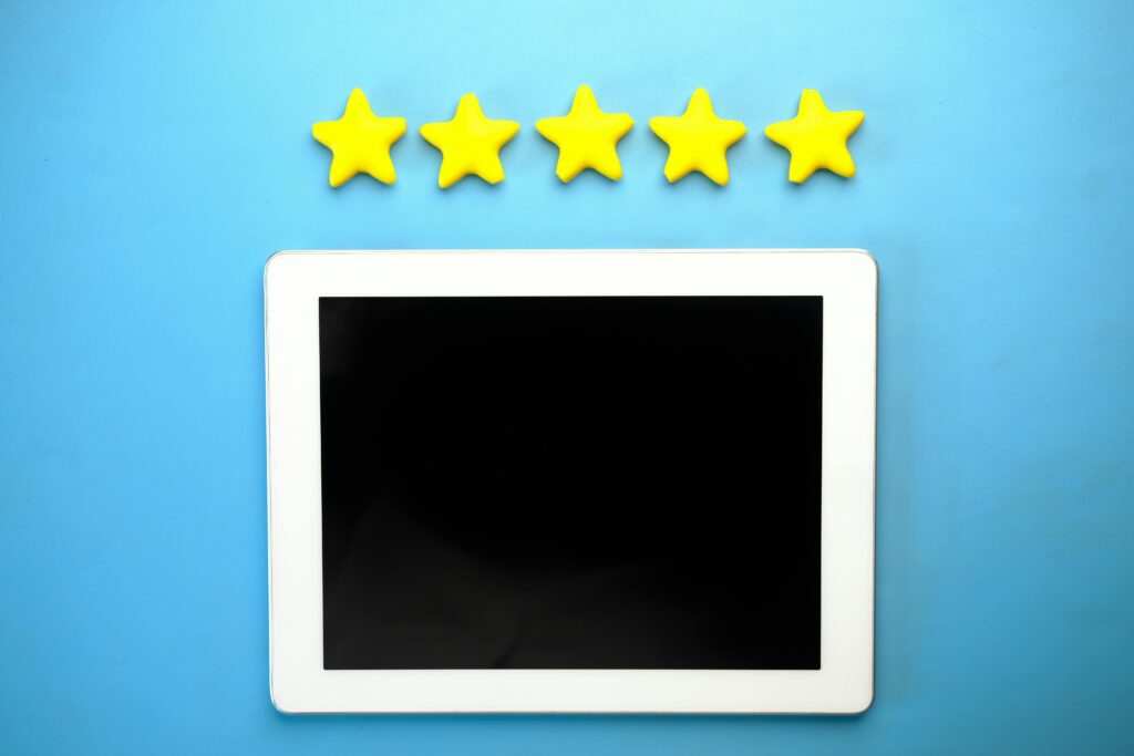 Five stars above a tablet screen